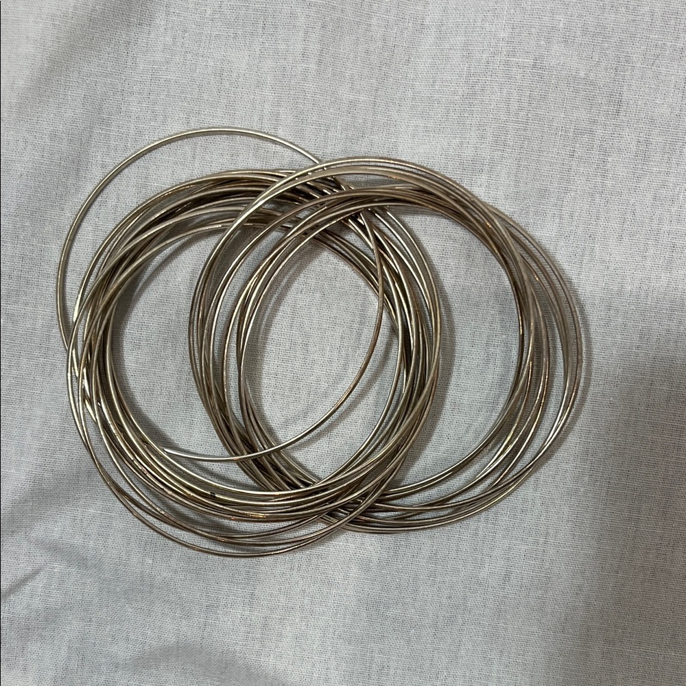 Stack of Thin Metallic Bangle Bracelets - Silver Tone